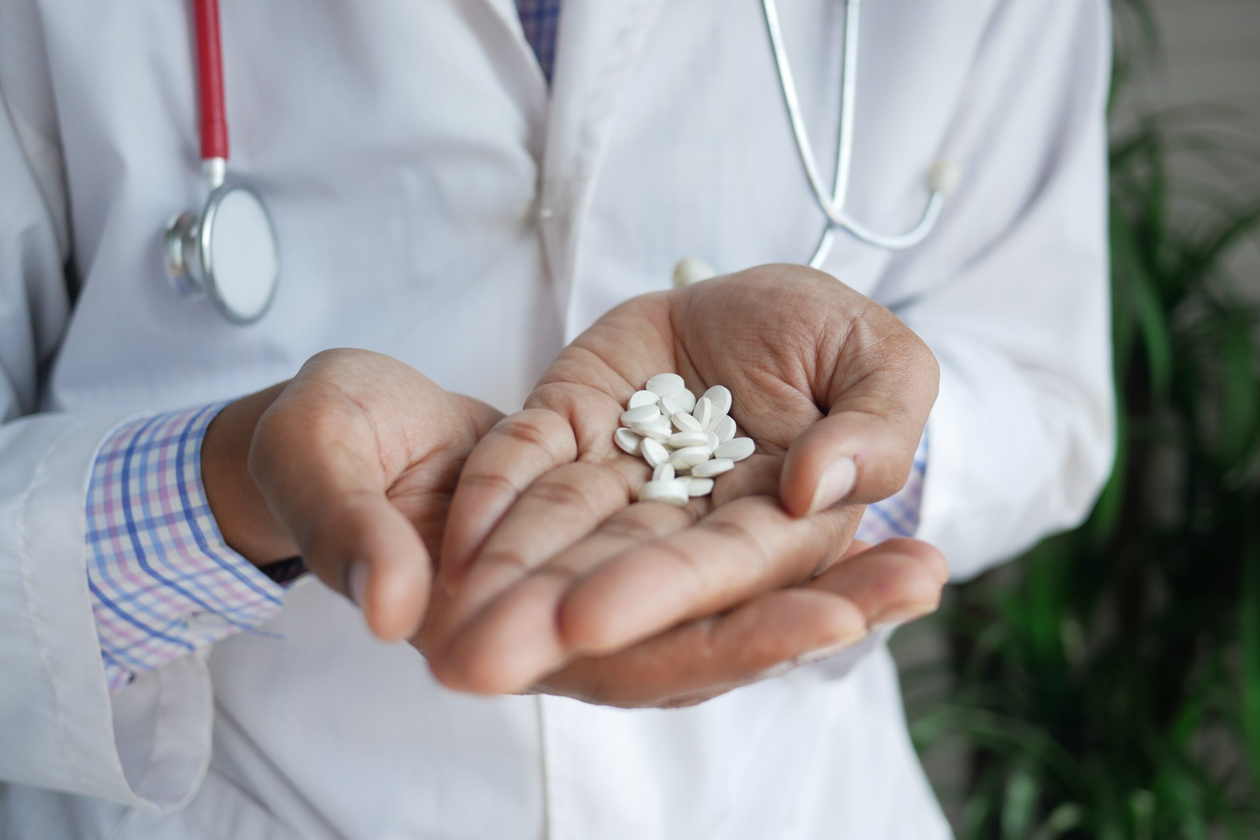 doctor holding pills